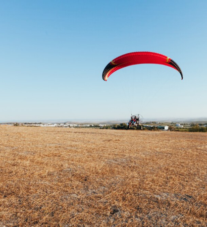 people-powered-paragliding-sky_181624-39262